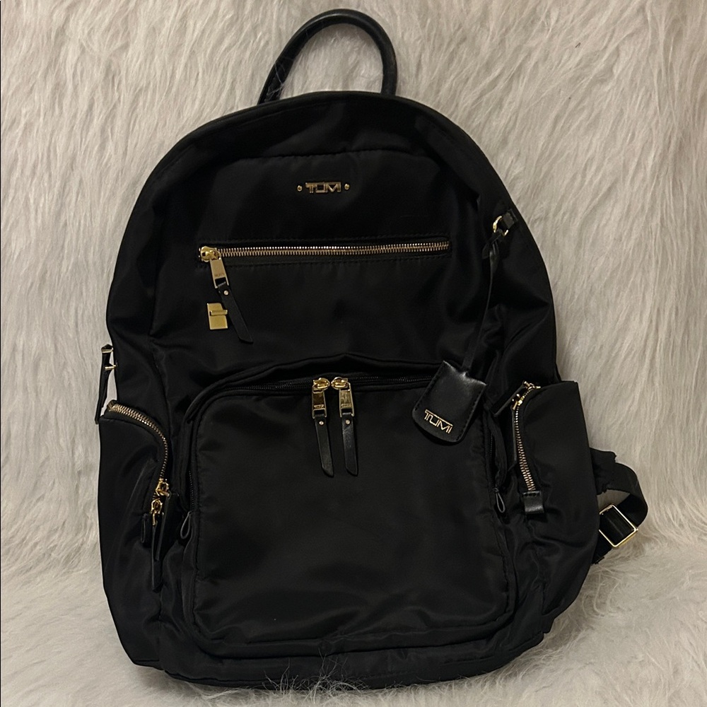 Tumi Black and Gold Backpack
